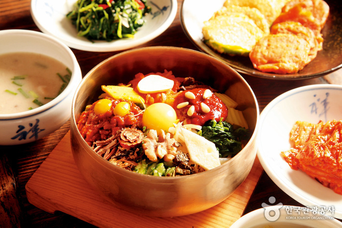 Jeonju-style bibimbap in a traditional brass bowl at Gogung restaurant